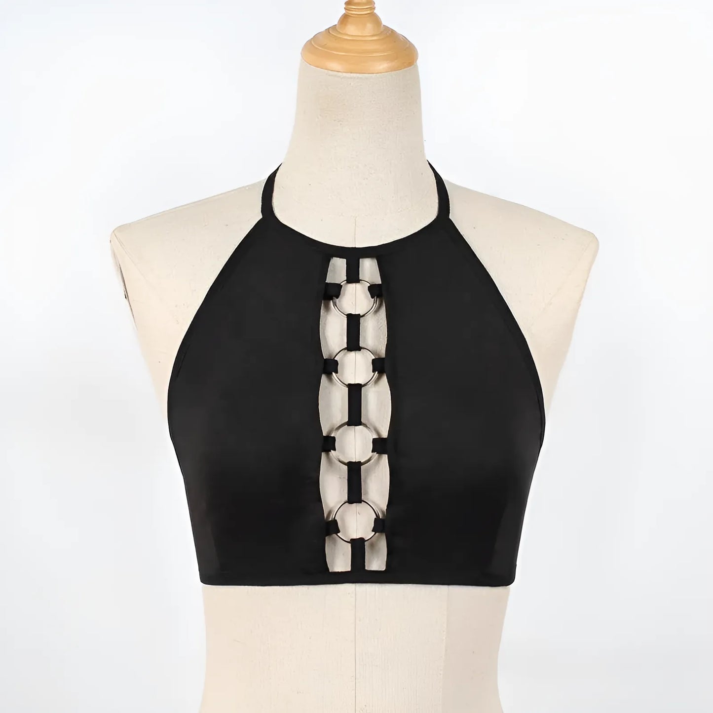 Biustonosz o kroju bralette z ozdobnymi kółkami